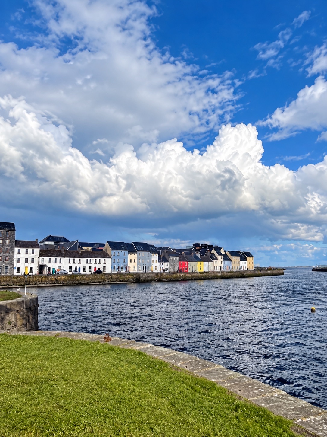 🌊 Galway, Ireland | An unexpectedly charming seaside town 🇮🇪

Galway is another city in Ireland that I've fallen in love with. It's a charming, relaxed city on the west coast, perfect for leisurely strolls. 🤍

The waterfront is one of my favorite spots. 🌊 The colorful houses line the shore, contrasting beautifully with the water and the vast blue sky. On clear days with lovely clouds, it's incredibly photogenic. 📸☁️

Galway's charm lies in its perfect blend of old town, culture, music, and seaside atmosphere. Walking into the city, you'll find charming little streets, restaurants, pubs, and shops. The city becomes even more lively and vibrant in the evenings.

If you have time, I recommend strolling along the waterfront and past the Spanish Arch before heading into the city. Enjoy the atmosphere along the streets. It's a city where you don't need a lot of planning to have fun. 🥰

📍 Galway, Ireland
🌊 Perfect for strolling along the waterfront.
🏘️ The colorful houses are another unique feature of the city.
🎶 The city has a vibrant music and cultural atmosphere.
📸 Photography enthusiasts and those who love small, cozy towns will love it.

For us, Galway isn't trying to be flashy, but it makes you want to slow down and stay longer. 💙 If you have the chance to visit Ireland, I highly recommend experiencing this city for yourself. 🇮🇪

#Galway #GalwayIreland #Ireland #VisitIreland #TravelIreland #TravelGalway #TravelAbroad #TravelReview #IrelandTravel #EuropeTravel #TravelWithMe