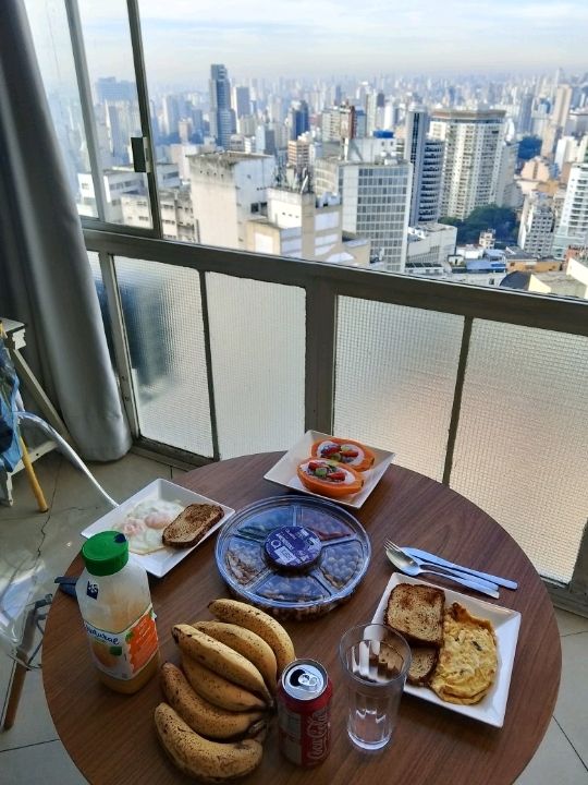 Try home made breakfast on top floor of iconic vintage building of copan with Sao Paulo skyline view