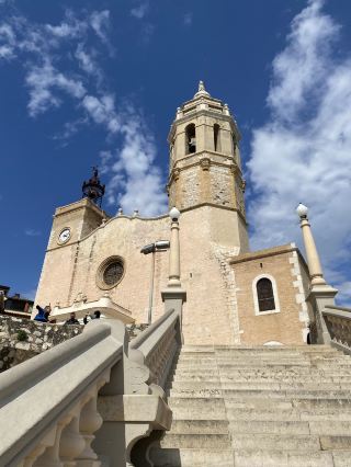 A stunning seaside town near Barcelona: Get lost in the streets of blue and white architecture.