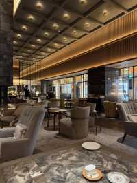 A lobby lounge with a fireplace🥂