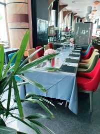 “Savor the Skyline: Eco-Luxury Dining at Envi”