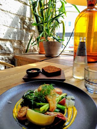 We went to "Rataskaevu 16," the most difficult restaurant to get a reservation at in Tallinn! We enjoyed their exquisite fish dishes and famous black bread.