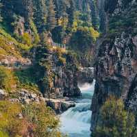 THE PICTURESQUE AHARBAL WATERFALL.