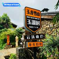 Quaint stone village under Yulong Mountains