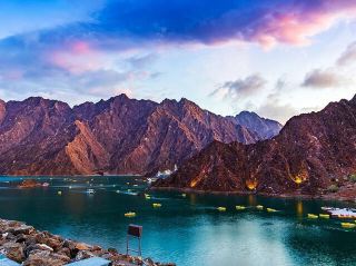 ⛰️ Hatta Mountain – Adventure & Nature in the UAE

📍 Location: Hatta is part of Dubai’s Hajar Mountains, about 115 km from Dubai city center. Known for its rugged landscapes, wadis, and outdoor activities.

✨ What to See & Do:
	· Hiking & Trekking 🥾 – Explore trails with views of mountains, valleys, and natural rock formations.
	· Hatta Dam & Lake 🚣 – Kayaking or paddle boating in turquoise waters surrounded by mountains.
	· Hatta Heritage Village 🏡 – Traditional Emirati village with restored houses, forts, and artifacts.
	· Mountain Biking 🚵♂️ – Trails for both beginners and advanced bikers.
	· Camping & Stargazing ✨ – Overnight stays in tents for a desert-mountain experience.
	· Photography Spots 📸 – Stunning views of peaks, valleys, and the dam.

🗺️ Trip Plan (1 Day):
	· Morning: Drive from Dubai to Hatta (1.5–2 hours). Stop at scenic viewpoints for photos.
	· Late Morning: Visit Hatta Dam 🚣, try kayaking or just relax by the water.
	· Afternoon: Explore Hatta Heritage Village 🏡 and nearby hiking trails 🌄.
	· Evening: Optional short hike for sunset 🌅 or stargazing ✨. Return to Dubai.

💡 Tips:
	· Best time: October – March 🌤️ for cooler weather.
	· Bring water 💧, sun protection 🧢, and trekking shoes 🥾.
	· Early morning arrival helps avoid crowds.
	· Drones allowed in some areas for photography (check local rules).

🌟 Why Visit: Hatta Mountain is the perfect escape from city life, offering adventure, nature, and a peek into traditional Emirati heritage—all within a few hours from Dubai.