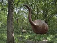 Art sculptures lost in a forest