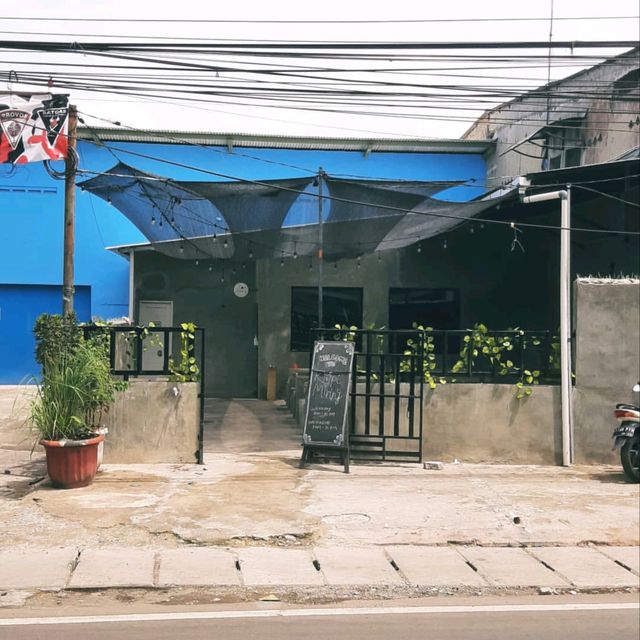 ONE OF THE COFFEE SHOPS NEAR A TRANSJAKARTA BUS STOP