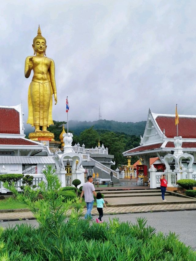 A colossal standing Golden Buddha in Hatyai