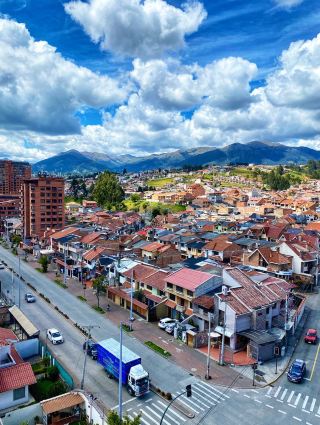 Cuenca — The Ecuadorian City Where Blue Domes Rise Above Cobblestones and the River Carves Through