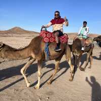 Enjoying camel ride in dessert