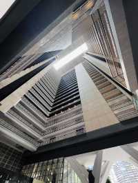 “Elegance in Motion: The Grand Lobby and Iconic Spiral Staircase of Hotel Maya KL”