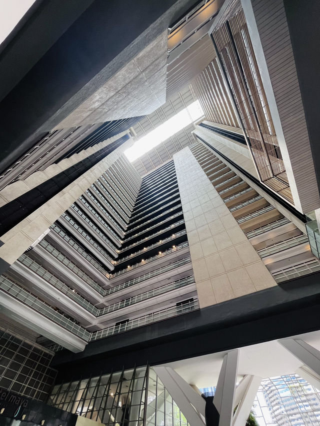“Elegance in Motion: The Grand Lobby and Iconic Spiral Staircase of Hotel Maya KL”
