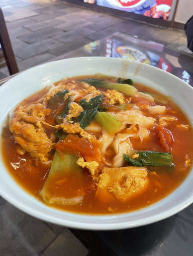 中国グルメ】西紅柿鶏蛋刀削麺 | Trip.com 北京