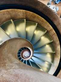 “Elegance in Motion: The Grand Lobby and Iconic Spiral Staircase of Hotel Maya KL”