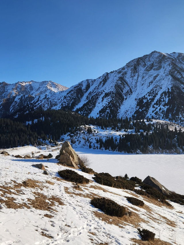 Still waters, snowy peaks, and silence