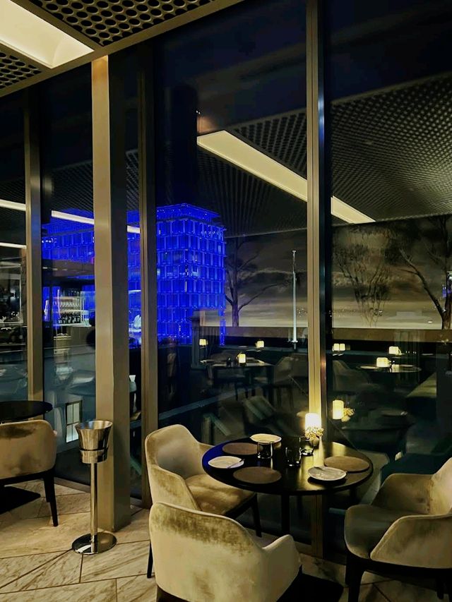 fine-dining destination perched atop the COMO The Treasury hotel, offering panoramic views