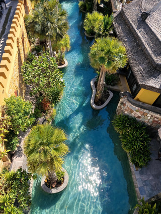 Hide away in a high-rise apartment by the Bangkok riverside, with the golden sunset of Wat Arun right outside your window