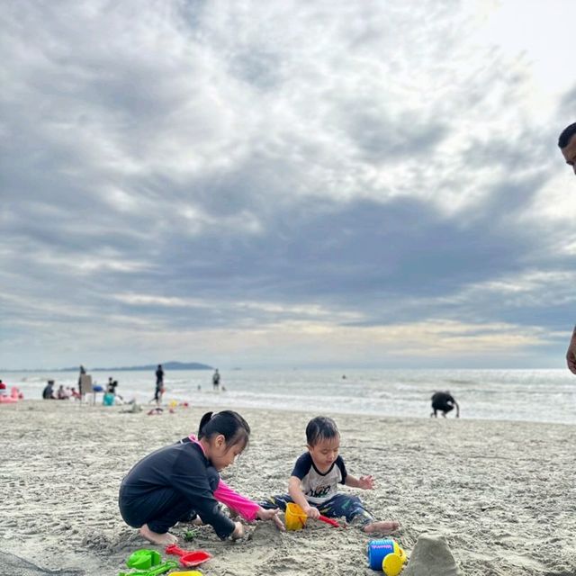 "Sunset Shores: A Perfect Day of Sandcastles and Joy"