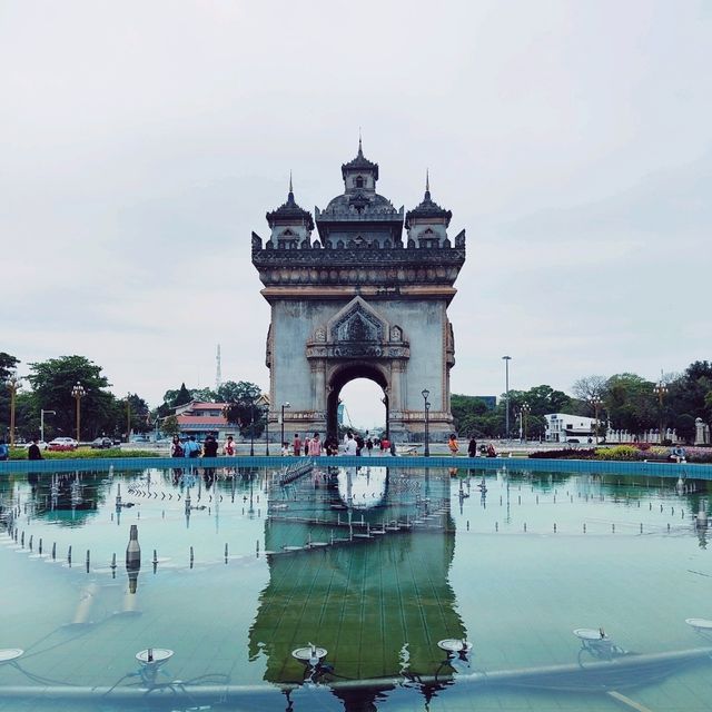 Ascending to Elegance: Patuxay's Embrace Above Vientiane