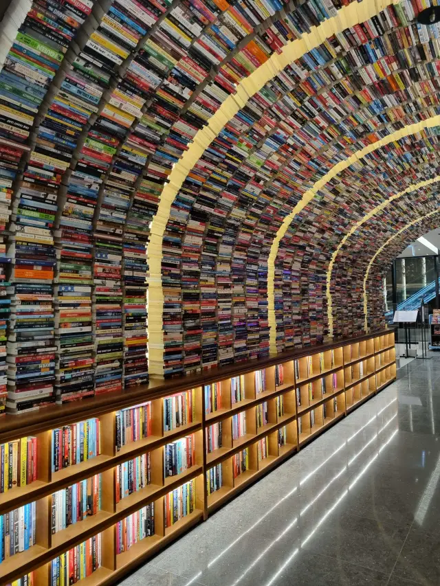 Snap a photo at the signature book tunnel.