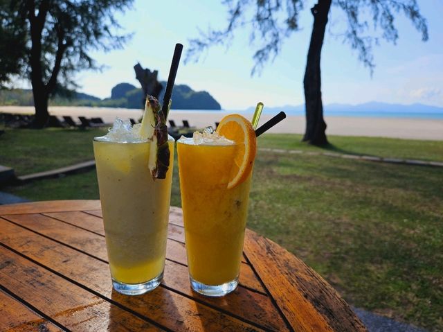 Relaxing and sipping a refreshing glass of juice at Tanjung Rhu Resort