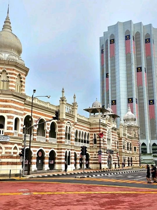 This historic iconic building looks magnificent and well-maintained, and is lit up with colorful lig
