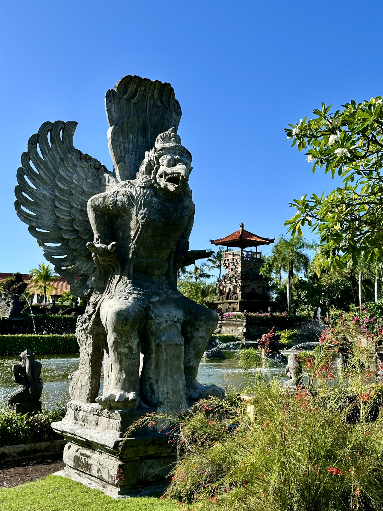 This isn't my first time coming back to Ayodya 🥰 It won my heart a decade ago when we first stayed here.
Founded over 20 years ago as one of the pioneering hotels in Nusa Dua, it beautifully showcases the culture of the island and the Balinese people 💎
🪷Right as you enter the hotel, you are struck by its scale and grandeur—statues and practically a whole temple made of volcanic rock, fish ponds, and, of course, lush gardens 🌿
🌳The hotel is surrounded by lush greenery, and the diverse blooming plants and flowers are a feast for the eyes. 
The lobby is crafted from wood, bamboo, and other natural materials. You are welcomed by statues of a Goddess and Ganesha, the scent of incense, and a welcome drink in a unique glass. 
💯 The hotel service is top-notch, with polite and helpful staff. 
🪴The rooms range across different categories, from budget-friendly options to the more premium Ayodya Palace segment. 
🌱Ayodya Palace is set in separate buildings closest to the ocean. It features a private pool, an exclusive lounge serving breakfast and afternoon tea, and renovated rooms.
🎋My photos show an upgraded Premium room, which is slightly pricier than the standard one, but feels fresher and cozier after the renovation. It has everything you need: crisp bed linen, excellent hot water pressure, and a large, comfortable bathroom.
🍳Breakfast is served on a floor overlooking the pond, with seating available both indoors and outdoors. The food is delicious, though a bit repetitive. 
🌊 The beach😍 is absolutely the best for swimming all day long, regardless of the tides—the water is always deep enough. The coastline is incredibly long, making beach walks a real pleasure. 
💎The beach scenery changes a million times throughout the day; it's truly unforgettable!
I keep coming back to this hotel for the vibe and the beach 🥰

✈️Location and Transportation 
The hotel is located in Nusa Dua, at the very southern tip of the Bukit Peninsula in Bali. There's a toll road across the bay from the airport, making the drive only 20–30 minutes. 
I always book my airport transfers on Trip—they offer great market rates, nice cars, and a reliable meet-and-greet service at the airport. 

🥗Where to Eat?
1. At the hotel: There's a vegan cafe, the Ganesha Indian restaurant (which serves amazing food), the main dining restaurant, and a Japanese restaurant.
2. Near the hotel: Just a three-minute walk away, you'll find a street lined with restaurants, bars, massage parlors, and shops.
3. Bali Collection: A sprawling outdoor complex with shops, a market, restaurants, cafes, and more. It offers a wide variety of cuisines: local, Indian, Japanese, Chinese, European, fusion...

🪷For an affordable massage, I highly recommend Widya Spa—it's located on the street near the hotel and offers a pick-up service.

☘️Ayodya Resort Bali is a fantastic choice if you want to experience Balinese culture while enjoying endless ocean swims ☘️

Have a great trip! ☺️ 
  