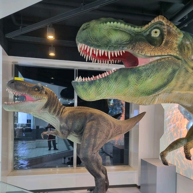 High tech hotel check-in with Robots and Dino