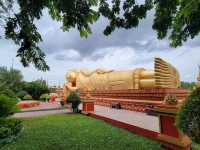 Be calm and enjoy the glow of the golden reclining Buddha in Laos! 