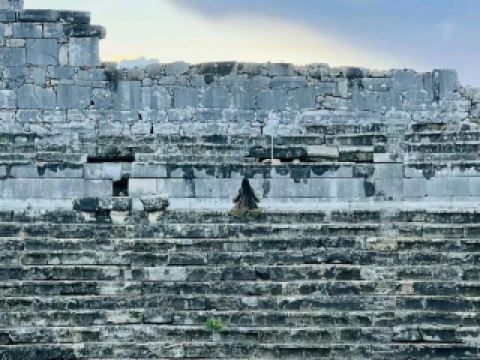 #winterescape Step into Ancient Legends at Xanthos Antik Kenti 🏛️✨  
Wander through the timeworn ruins of Xanthos, a UNESCO World Heritage site just outside Kaş, where Lycian, Greek, and Roman stories blend amid crumbling temples, grand tombs, and an impressive amphitheater. Whether you're a history buff or just love epic scenery, Xanthos is a must-see slice of Turkiye’s ancient soul.  

Your Xanthos Itinerary:  
Start your visit by following the main path right from the entrance, which quickly brings you to the awe-inspiring Roman theater—a perfect spot for panoramic photos with the Lycian tombs in the background. Make sure to climb up for a bird’s-eye view of the entire site and the lush valley beyond; sunset light makes every snapshot insta-worthy.  

Next, wander towards the Harpy Tomb and the Lycian sarcophagi, which are scattered across the plateau—each offering their own story (and a dramatic photo op with the wildflowers in spring!). Don’t forget to explore the Byzantine basilica ruins for those moody, atmospheric shots.  

Tips to Maximize Your Visit:  
Arrive early in the morning to beat both crowds and midday heat. There’s limited shade and few amenities—bring water, a hat, sunscreen, and sturdy shoes (ancient stones can get slippery!). English signage is decent, but a quick read about Lycian history beforehand really brings the place to life. Lastly, keep an eye out for tortoises and wildflowers along the paths—nature’s own little surprises.  

#Kas #Xanthos #AncientRuins #TravelTurkey #HistoryExplorers