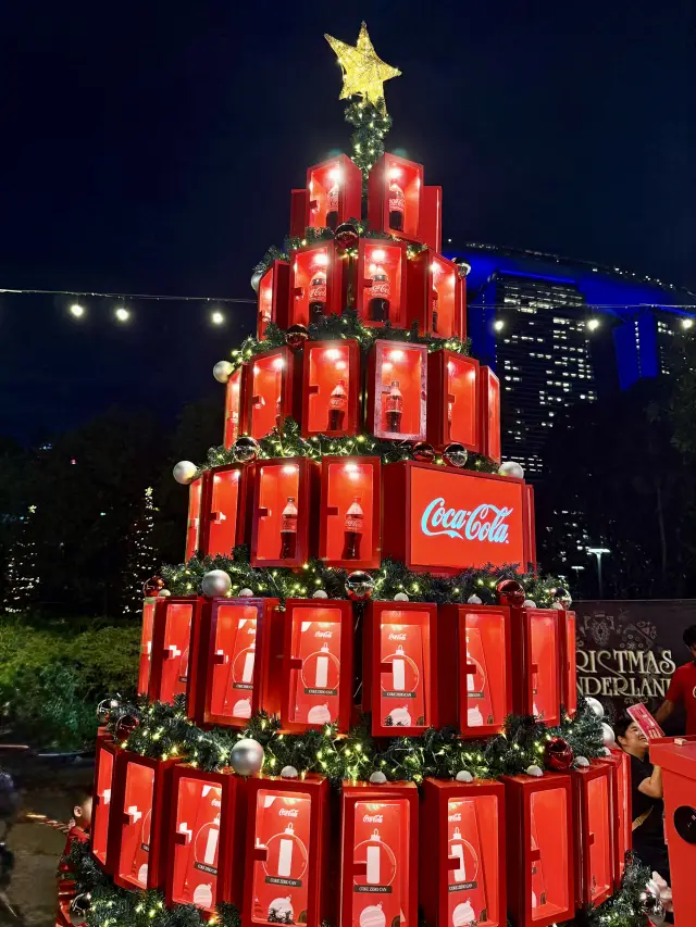 A Giant Coca-Cola Tree Lighting Up Christmas Wonderland