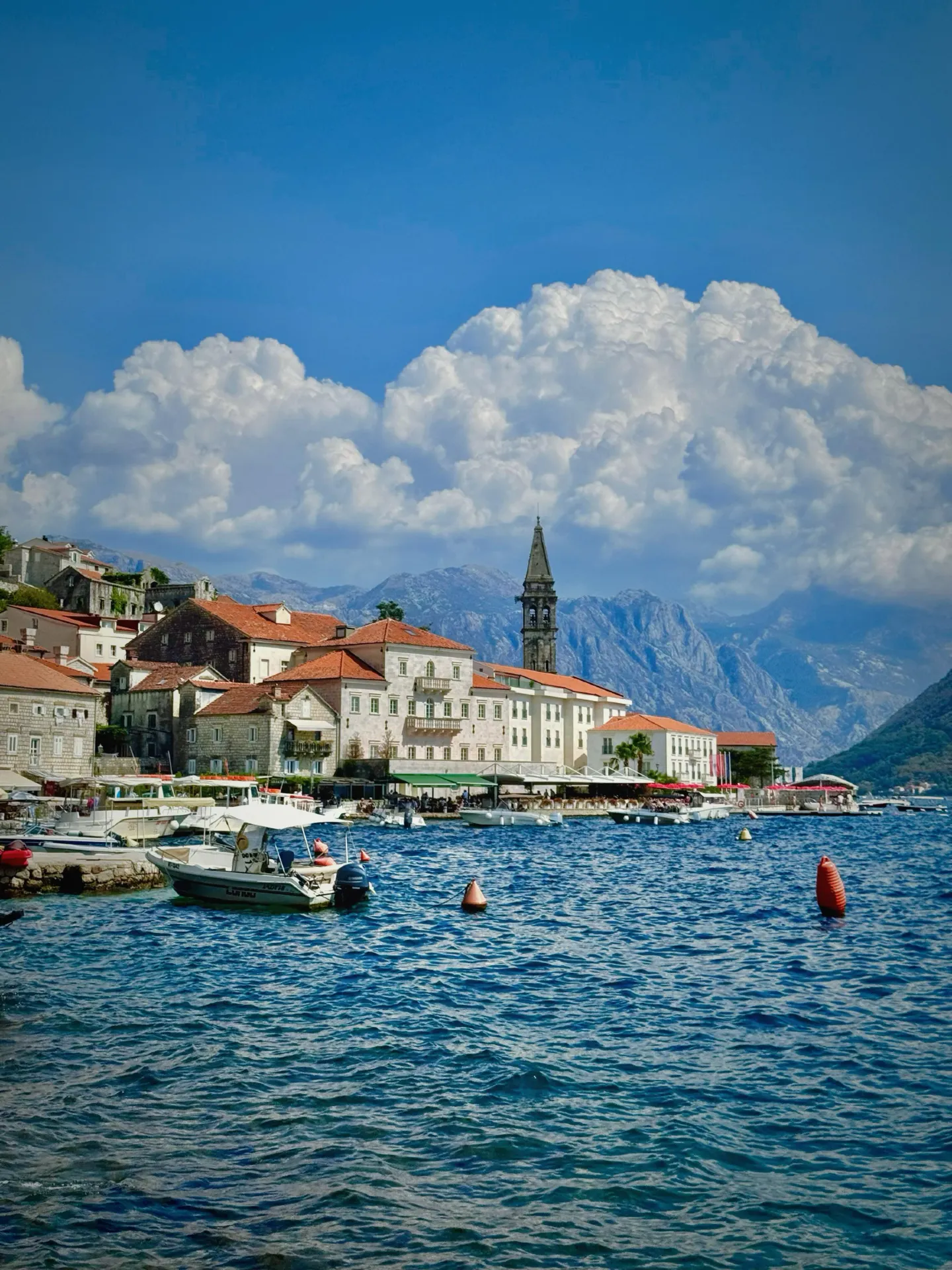 Stop fighting the crowds in Kotor! The nearby cool-toned town of Perast is the real hidden gem