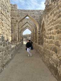 “Whispers of the Past: The Timeless Walls of Bahrain Fort”