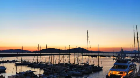 Alghero - Sunset Between the Boats — traveler post in Alghero