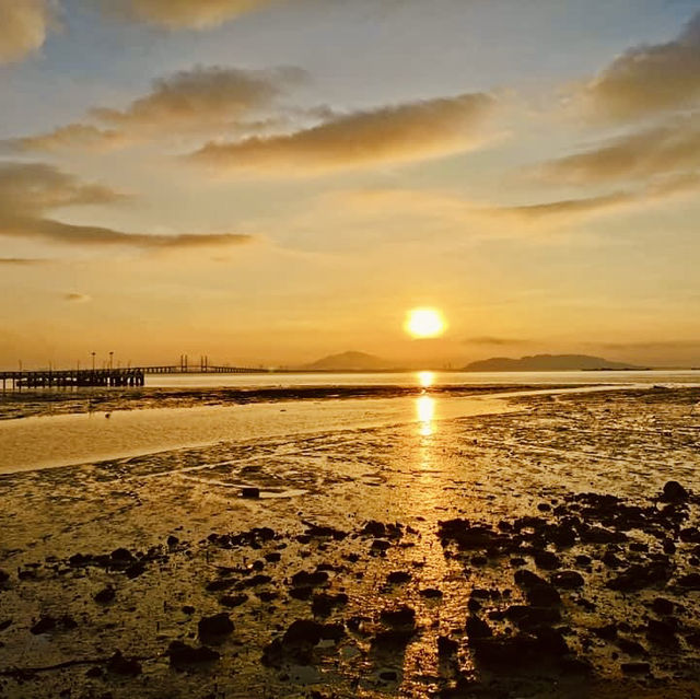 "Captivating Sunsets: A Visit to Penang Beach by the Bridge"