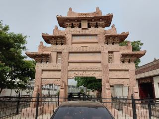 4 square meters. In 1962, the Gansu Provincial People's Government announced Luochuan Zhao's Stone Archway as a provincial cultural relic protection unit. In May 2006, the State Council announced Luochuan Zhao's Stone Archway as the sixth batch of national key cultural relic protection units.
The Luochuan Zhao Family Stone Archway was built to honor the character of Zhao Bangqing, an upright official of his generation. It consists of three stone archways, namely, Qingguan Archway, Tianguan Archway and Enchong Archway, which were built successively on the east-west streets of Luochuan Community. Qingguan Archway was built on December 12, the 42nd year of the Wanli reign of Emperor Shenzong of the Ming Dynasty (1614 AD); Tianguan Archway was built on April 15, the 43rd year of the Wanli reign of Emperor Shenzong of the Ming Dynasty (1615 AD). Both archways are of four-pillar, three-room, two-story pavilion style, both are 8.4 meters high and 8.2 meters wide. They were erected by Qingyang Prefecture of Shaanxi Province and Zhenning County in the Ming Dynasty to commemorate Zhao Bangqing, a doctor of the Ministry of Personnel of the Ming Dynasty. Both are archways of famous officials. Enchong Archway was built by Zhao Bangqing on the third day of July in the forty-fifth year of the Wanli reign of the Ming Dynasty (1617 AD) to publicize the imperial decree of Emperor Wanli and to commemorate the grace of his parents in raising him. It is a three-story pavilion with four pillars, three rooms, 9.7 meters high and 8.35 meters wide. It was used to praise merits or commend chastity and is an archway for chaste women. The Zhao's Stone Archways in Luochuan all have hip roofs with brackets and are made of red sandstone. They have spectacular shapes and unique structures. They are carved with vivid images of people, mountains, water, clouds, trees, flowers, birds and animals. The carvings are delicate and lifelike, demonstrating superb architectural art. They are a perfect combination of ancient Chinese architectural modeling art and carving art. It contains rich historical and cultural information and is an important carrier of ancient folk customs. In addition, the Three Purities Stele and the Insist on Integrity Stele are important relics of Zhao Bangqing's clean officialdom and important representatives of ancient anti-corruption culture. They have important inspiration and educational effects on contemporary officials.
