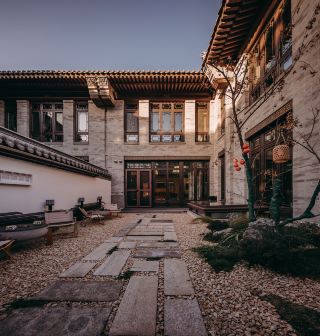This guesthouse by the ancient city wall offers a view of the starlit city wall right from the window