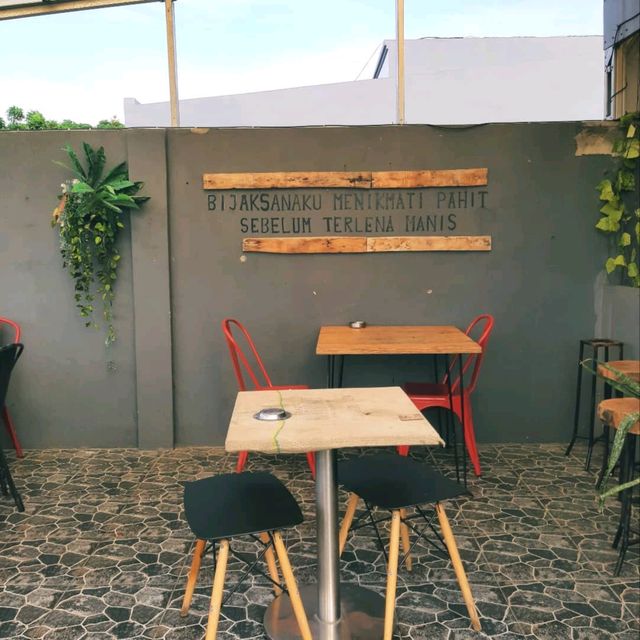 THIS PLACE HAS A ROOFTOP AND A ROASTERY ON THE SECOND FLOOR