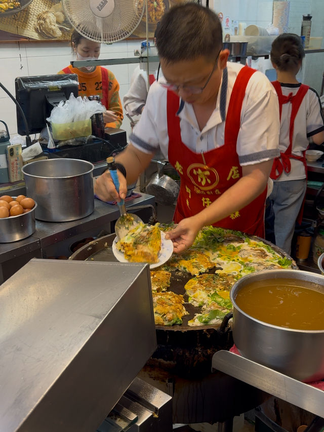 Oyster Egg Omelette on Conveyor Belt: Michelin Dish at Ningxia Night Market