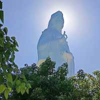 Peace and tranquility beside a giant Buddha.