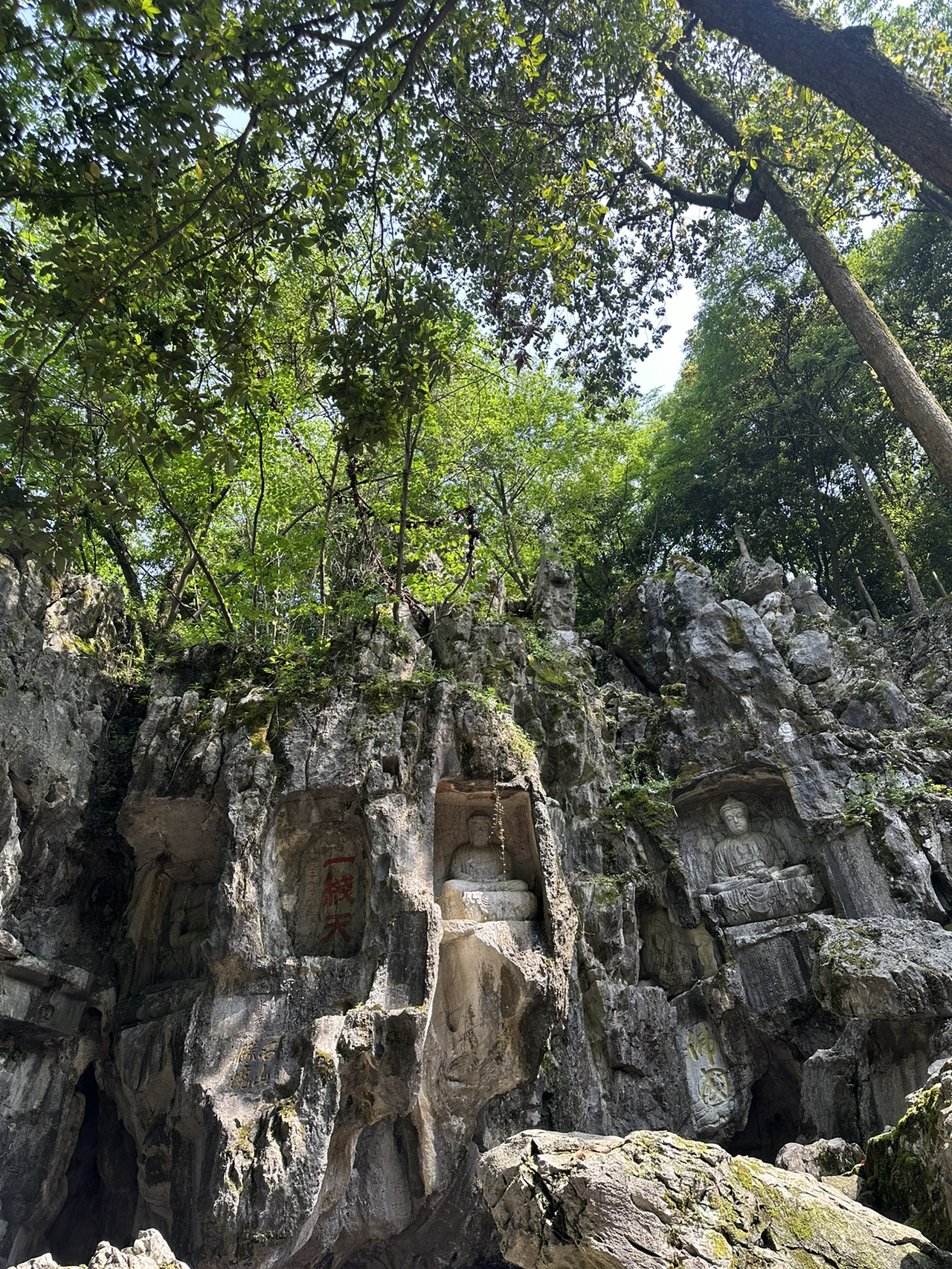 Lingyin Temple is a sacred, all-in-one destination, especially famous for granting blessings for good fortune, wealth, smooth career paths, and good health. 
Guanyin is here for those praying for love and children.

Don't miss the Buddha statues carved into the caves at Feilaifeng (Flying Peak). 
The atmosphere is peaceful and shaded. There’s so much to explore around the temple grounds, from hiking up the mountain to pay respects to the Buddhas to visiting the various worship halls. There is a flowing spring right in front of the main hall, where you'll see locals filling up bottles and using the water to wash their faces and hands for good luck. 

A must-visit photo spot is the massive carving of the Maitreya Buddha, which is the largest of its kind.
If you're into amulets, necklaces, or bracelets, they have some incredibly popular blessed bracelets available here. 

For our trip, we started at West Lake and took Bus No. 7, getting off at the Lingyin bus terminal (灵隐公交总站). For the return trip, we simply caught the bus from the temple back to West Lake.