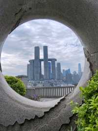 Doughnut Frames the Skyline: A Sweet Urban Snapshot