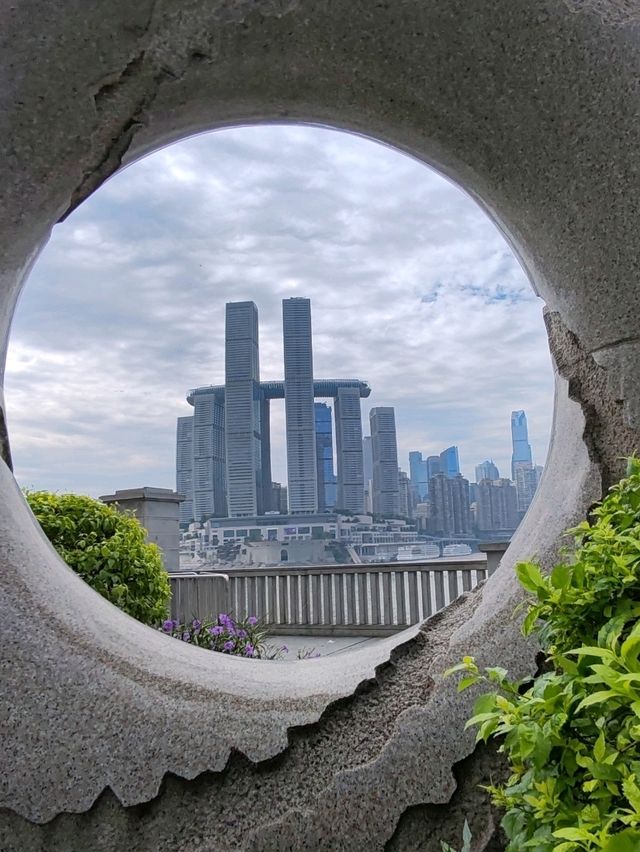 Doughnut Frames the Skyline: A Sweet Urban Snapshot