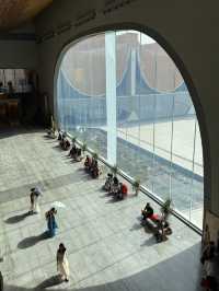 Stylish curvy Chinese museum about canal