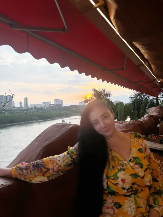 Enjoy delicious food and neon river views at the Mekong River View Restaurant.