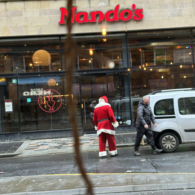 Santa catching a taxi in Glasgow