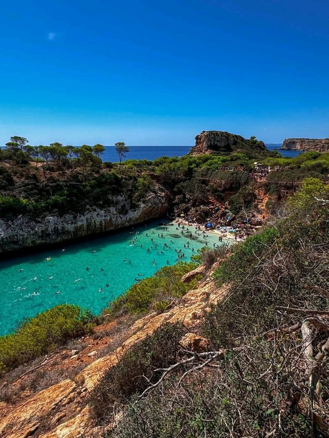 Turquoise Dreams and Sandy Toes at Cala Llombards