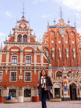 #springtravel 

🎭 The House of the Blackheads: Riga’s Architectural Crown Jewel✨

If there is one building that defines the spirit of Riga, it is the House of the Blackheads. Located in the heart of the Town Hall Square, its ornate red facade and golden details are so striking that they practically stop you in your tracks.
A Feast for the Eyes
Even if you don’t have time to head inside, the exterior is a masterpiece of its own. Built in 1334 (and beautifully reconstructed), it served as the headquarters for the Brotherhood of Blackheads - a guild of wealthy, unmarried merchants who certainly knew how to build in style!
Look closely at the facade: You’ll see intricate sculptures and a grand astronomical clock that shows the time, date, and even the phases of the moon.

The Legend of the First Christmas Tree
Right in front of the house, keep an eye on the ground! You’ll find a stone marker identifying the spot where the world’s first public Christmas tree was allegedly decorated back in 1510. It’s amazing to stand on a spot with such a festive global legacy.

Why You Should Visit the Square:
· Photographer’s Dream: The contrast of the red bricks against the blue Riga sky is perfection.
· The Atmosphere: The Town Hall Square is the heart of the city. Grab a coffee nearby and just soak in the Hanseatic vibes.
· Evening Magic: I highly recommend swinging by after sunset. The building is illuminated so beautifully it looks like something out of a fairytale.

My Takeaway: Even though I didn't get a chance to explore the medieval cellars and grand ballrooms inside this time, the House of the Blackheads remains my favorite landmark in Riga. It’s the ultimate "must-see" that earns its spot on every postcard!

#Riga #Latvia #HouseOfTheBlackheads #VisitRiga #LatviaTravel #Architecture #TravelPhotography #BalticBeauty #TravelTips
