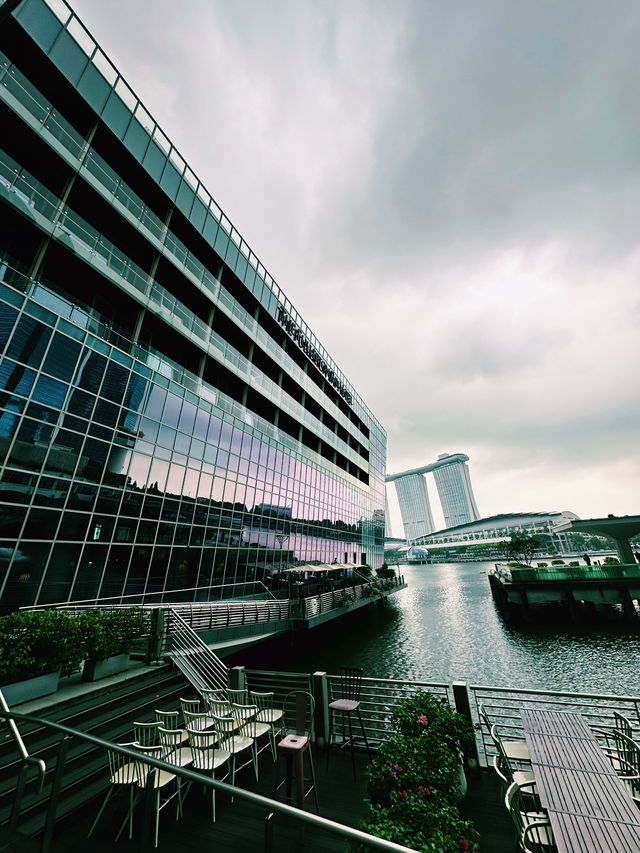 Calm Before the Rain: A Waterfront Stroll Near The Fullerton Bay Hotel
