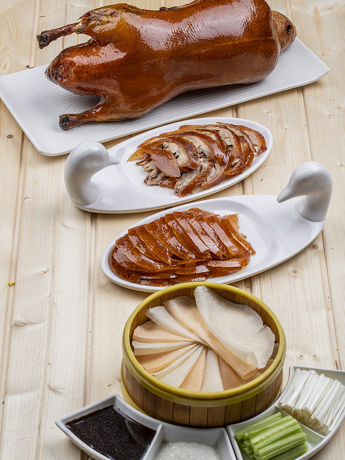 Want to dive into the world of classic Chinese cuisine? We've put together a list of dishes that will absolutely win your heart! 

Ready to discover the vibrant flavors of the Middle Kingdom? 

Save this list for your next trip to China! ✨

🍢 1. 宫保鸡丁 (Gōngbǎo jīdīng) — Kung Pao Chicken
A classic dish of Sichuan cuisine. Tender chicken cubes are stir-fried with peanuts, dried red chilies, Sichuan peppercorns, and a sauce made of soy sauce, vinegar, and sugar. The crunch of the peanuts, the heat of the chili, and the tender meat — it's impossible not to love this dish 🔥.

🥟 2. 饺子 (Jiǎozi) — Dumplings
Handmade wheat flour dumplings with various fillings — from minced meat to shrimp and vegetables. They can be cooked in different ways: boiled, steamed, or pan-fried. Served with a dipping sauce of soy sauce, vinegar, and chili oil. Juicy and flavorful — an ideal choice for a festive table or a cozy family dinner 🍜.

🍤 3. 麻婆豆腐 (Mápó dòufu) — Mapo Tofu
Tender tofu cubes in a fiery-red sauce made of fermented bean paste, minced meat, Sichuan peppercorns, and chili oil, sprinkled with scallions. The contrast between the silken tofu and the vibrant spice will not leave you indifferent.🌶️

🍖 4. 红烧肉 (Hóngshāo ròu) — Braised Pork Belly
Pork belly slowly braised in a rich sauce of soy sauce, brown sugar, Shaoxing wine, and star anise. The result is melt-in-your-mouth pork with caramelized edges. The sweet and savory balance and richness of flavor make this dish unforgettable 😋.

🍢 5. 糖醋排骨 (Tángcù páigǔ) — Sweet and Sour Pork Ribs
Crispy pork ribs coated in a bright red sauce made of pineapple juice, ketchup, vinegar, and peppers. 

🦆 6. 北京烤鸭 (Běijīng kǎoyā) — Peking Duck
Duck roasted in a special oven until crispy. Served sliced with thin pancakes, hoisin sauce, cucumber, and scallions for wrapping. The ritual of assembling the dish and the contrast of rich duck with crispy skin will be remembered for a long time 🦃.

🌱 7. 干煸四季豆 (Gān biān sìjì dòu) — Dry-Fried Green Beans
Green beans stir-fried in a hot wok with minced meat, dried chili, and fermented black beans. This dish is so popular that it can be found on the menu of almost all restaurants. 

🍢 8. 狮子头 (Shīzǐtóu) — "Lion's Head" Meatballs
Giant pork meatballs (in exquisite versions with crab roe), braised in a clear broth with Napa cabbage. The name refers to the size of the dish — it is truly impressive! 

🥯 9. 葱油饼 (Cōngyóu bǐng) — Scallion Pancakes
Flaky pancakes with scallions and sesame oil, pan-fried to a golden crisp on the outside and soft on the inside. They are eaten by tearing them into pieces and dipping them into soy or chili sauce. A simple yet highly delicious street snack 🥩.

🍚 10. 扬州炒饭 (Yángzhōu chǎofàn) — Yangzhou Fried Rice
Everyone's favorite fried rice with diced ham, shrimp, egg, peas, and carrots. Excellent both as a side dish and as a main course. 

🌊 11. 蒜蓉粉丝蒸扇贝 (Suàn róng fěnsī zhēng fánbèi) — Steamed Scallops with Garlic and Vermicelli
Fresh sea scallops with glass noodles, minced garlic, and scallions, steamed to perfection. A light soy sauce dressing highlights the ocean flavor and the aroma of garlic 🌊.

🍗 12. 海南鸡饭 (Hǎinán jīfàn) — Hainanese Chicken Rice
Tender poached chicken served sliced over fragrant jasmine rice cooked in chicken broth. Accompanied by cucumber slices, a chili-garlic sauce, and a ginger-scallion sauce.

🍢 13. 锅包肉 (Guōbāo ròu) — Guo Bao Rou (Sweet and Sour Pork)
Crispy fried pork strips coated in a sweet and sour pineapple sauce with bell peppers and onions. This Northeastern Chinese appetizer will delight fans of sweet and sour flavors 🍢.

🍝 14. 兰州拉面 (Lánzhōu niúròu miàn) — Lanzhou Beef Noodle Soup
Hand-pulled wheat noodles in a clear, aromatic beef broth with beef slices, cilantro, daikon radish, and chili oil (optional).

🥟 15. 包子 (Bāozi) — Steamed Buns
Fluffy steamed wheat flour buns with a variety of fillings — from pork and cabbage to beef or even sweet red bean paste. The soft texture and juicy fillings make them the perfect choice for breakfast or a snack 🥟.

🍅 16. 西红柿炒蛋 (Xīhóng shì chǎo dàn) — Tomato and Egg Stir-fry
Ripe tomatoes stir-fried with fluffy scrambled eggs, seasoned with scallions and a pinch of sugar. The simple yet comforting flavor pairs perfectly with rice — this is a dish every Chinese person knows how to cook.

🍆 17. 地三鲜 (Dì sān xiān) — Di San Xian ("Three Treasures of the Earth")
Eggplants, potatoes, and green bell peppers pan-fried to a golden color with garlic and soy sauce. The caramelized vegetables deeply absorb the flavors — a fantastic vegetarian dish for vegetable lovers 🍆.

🍢 18. 鱼香肉丝 (Yúxiāng ròusī) — Fish-Flavored Shredded Pork
Thin strips of pork stir-fried with wood ear mushrooms, bamboo shoots, and carrots in a spicy and savory sauce made of chili, garlic, vinegar, and sugar (surprise: there's no fish in the recipe). 

✨ Which Chinese dish have you tried or would like to try? Share in the comments! 😋
Bon appétit!